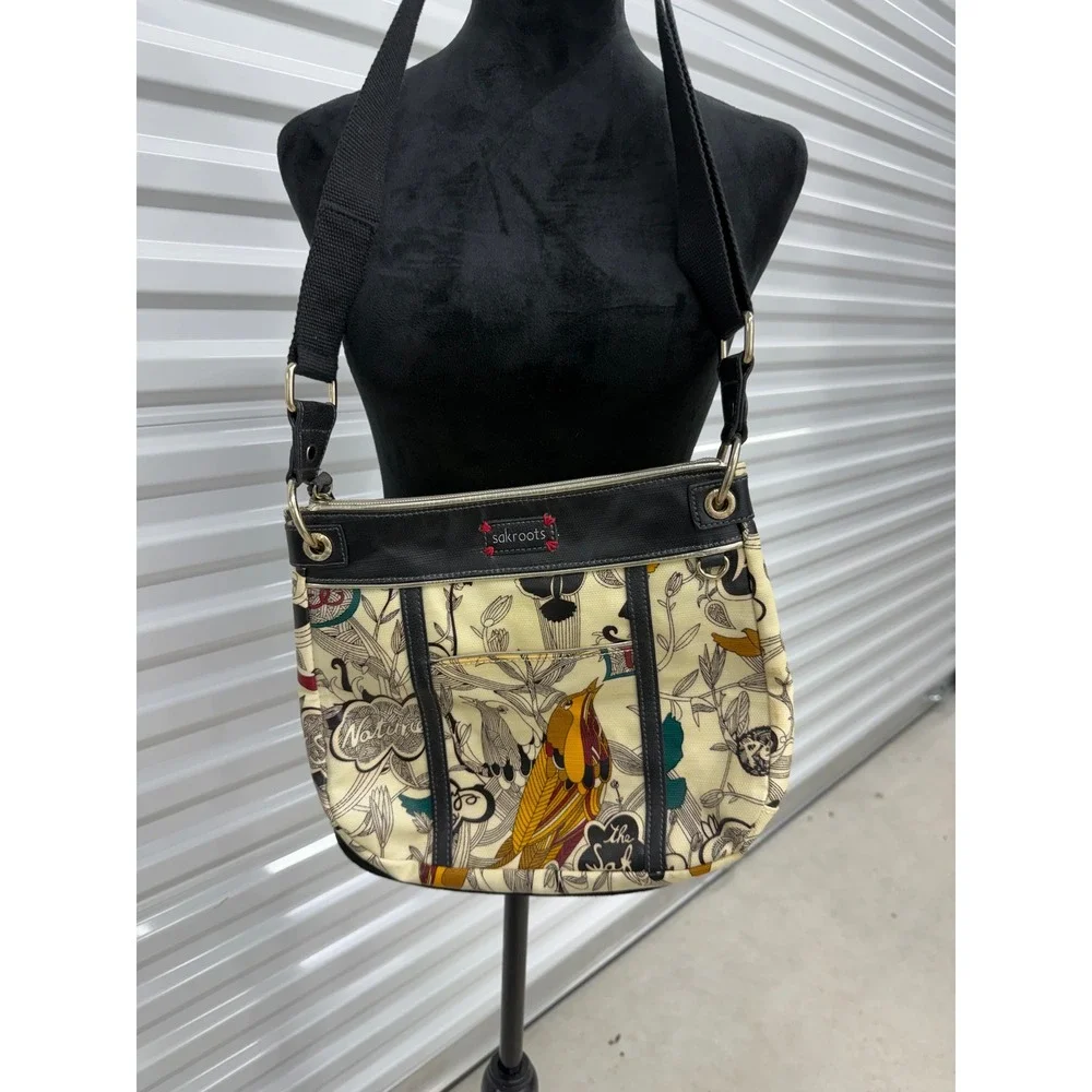 Sakroots Artist Circle Peace Print Bird Crossbody Bag Coated Canvas Cream Black